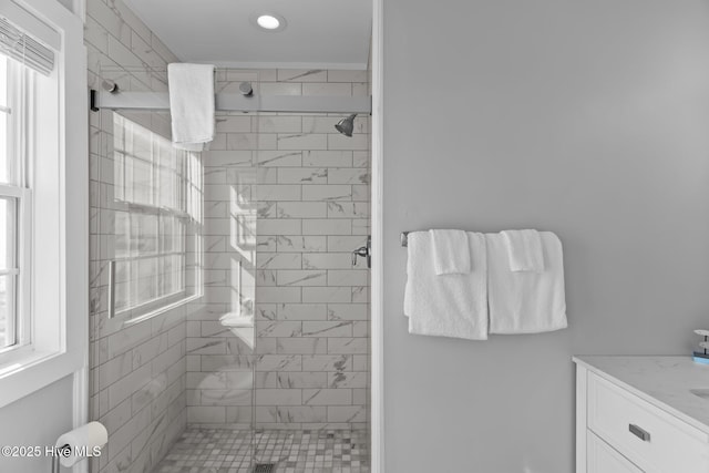 bathroom with vanity and a shower with shower door