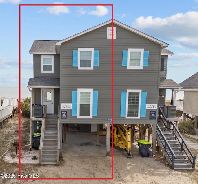 173 Ocean Blvd W # A, Holden Beach, NC 28462 - view of front of home with a porch, stairs, and roof with shingles