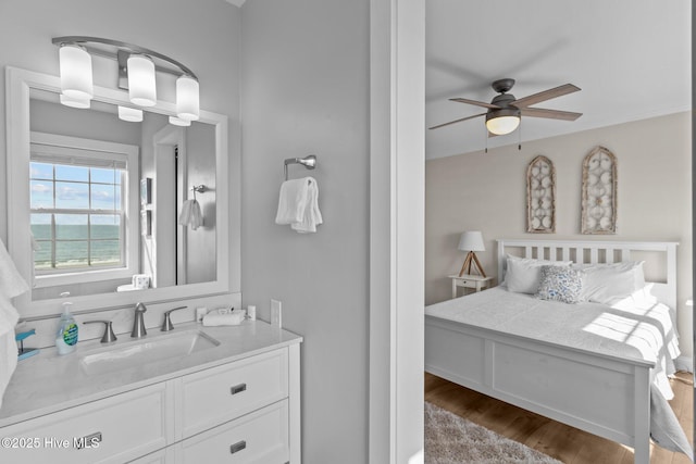 173 Ocean Blvd W # A, Holden Beach, NC 28462 - bedroom with wood finished floors, ornamental molding, and baseboards
