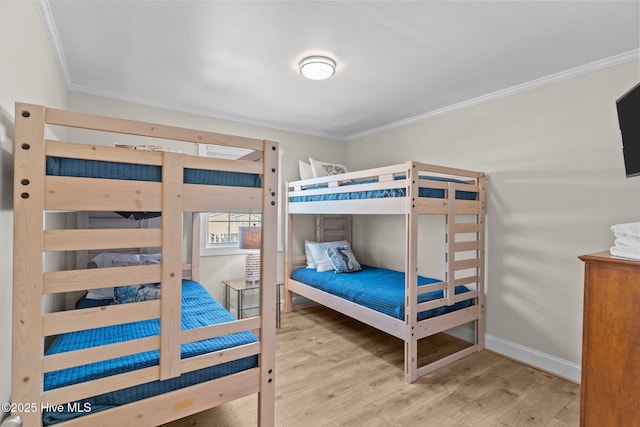 173 Ocean Blvd W # A, Holden Beach, NC 28462 - bedroom featuring ornamental molding and wood finished floors
