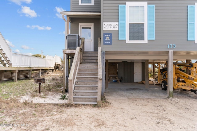 doorway to property featuring a carport