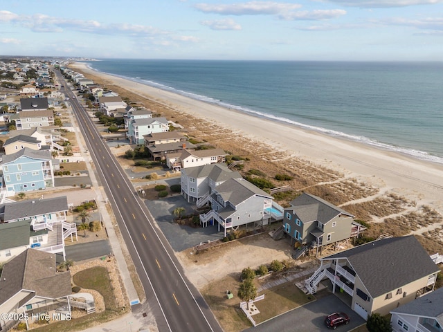 aerial view featuring a view of the beach and a water view