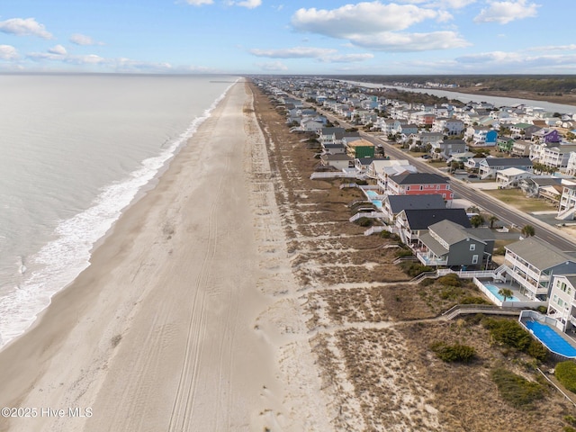 drone / aerial view with a view of the beach and a water view