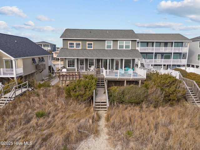 173 Ocean Blvd W # A, Holden Beach, NC 28462 - back of house with stairway, a shingled roof, and covered porch