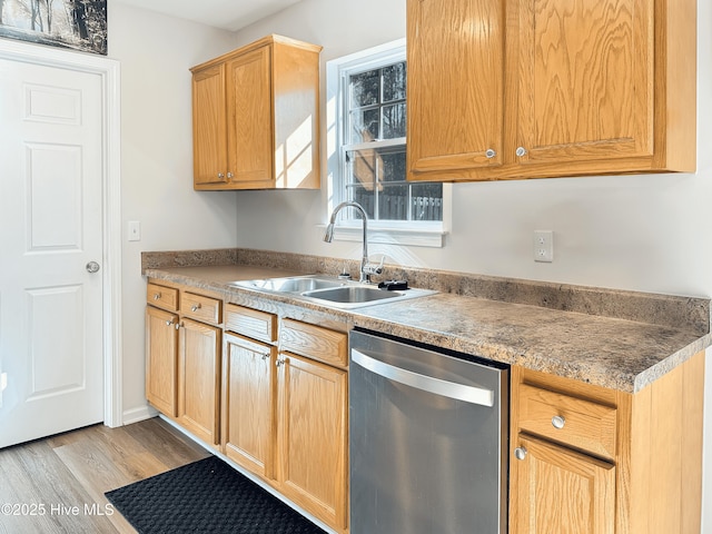 kitchen with sink, light hardwood / wood-style floors, and dishwasher