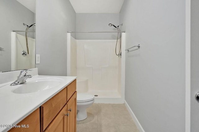 bathroom with toilet, tile patterned flooring, walk in shower, and vanity