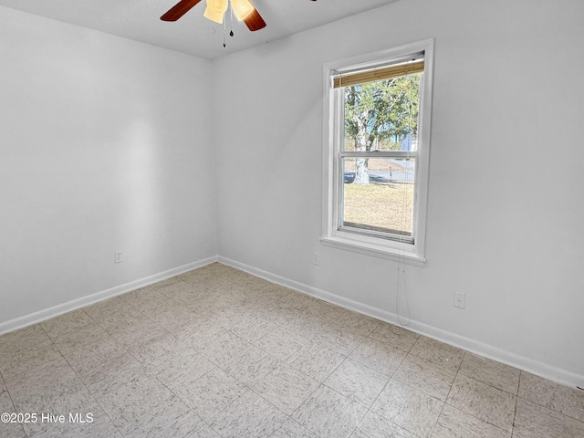 unfurnished room with ceiling fan