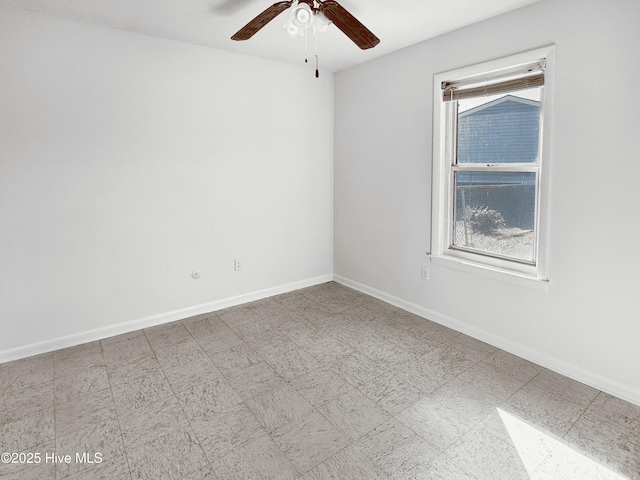 empty room with ceiling fan and a healthy amount of sunlight