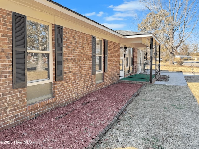 view of side of home with a patio