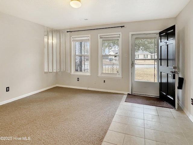 entryway featuring light tile patterned floors