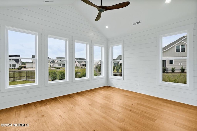 unfurnished sunroom with lofted ceiling and ceiling fan