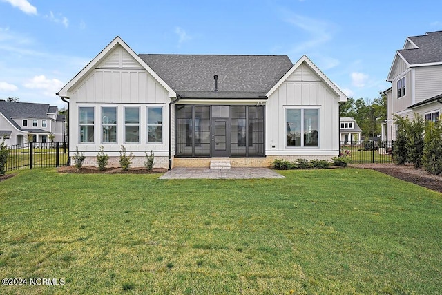 rear view of house with a lawn