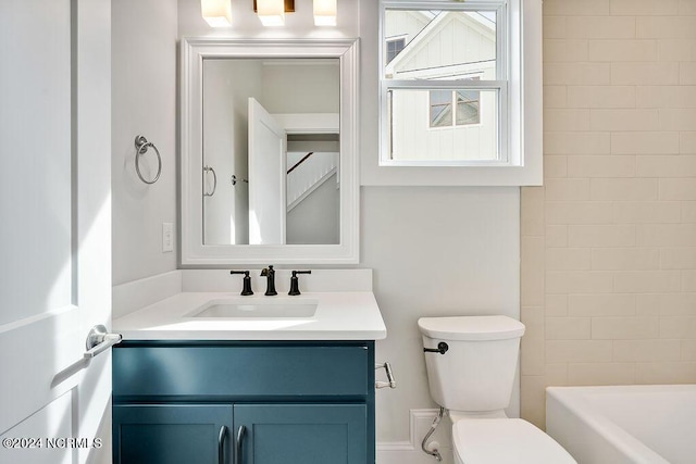 bathroom with toilet and vanity