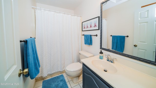 bathroom with tile patterned floors, toilet, and vanity