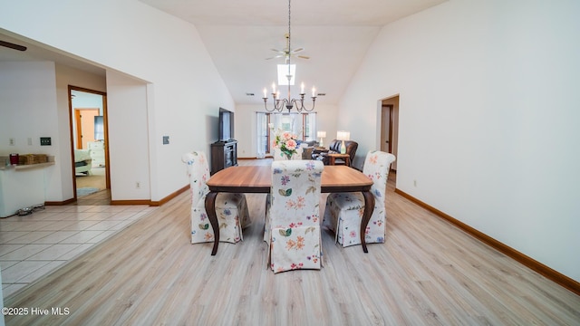 3 Bayberry Cir, Carolina Shores, NC 28467 - dining area with a chandelier, wood finished floors, and high vaulted ceiling