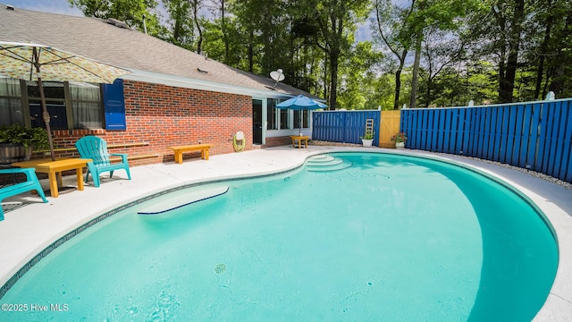 view of swimming pool featuring a patio