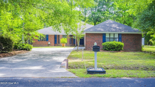 3 Bayberry Cir, Carolina Shores, NC 28467 - single story home featuring driveway, brick siding, and roof with shingles