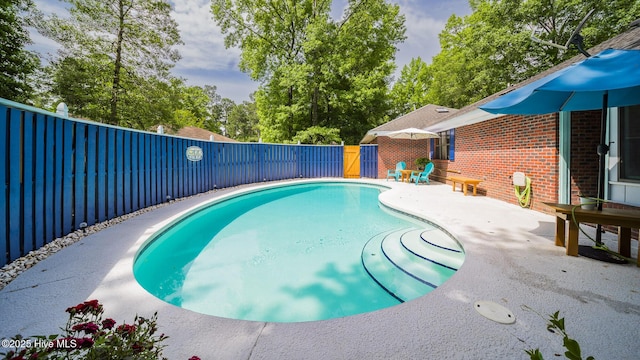3 Bayberry Cir, Carolina Shores, NC 28467 - view of swimming pool featuring a fenced backyard, a patio area, and view of scattered trees
