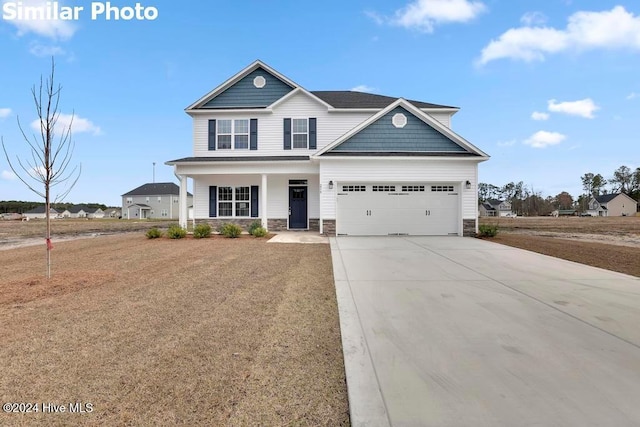 craftsman house with a front lawn and a porch