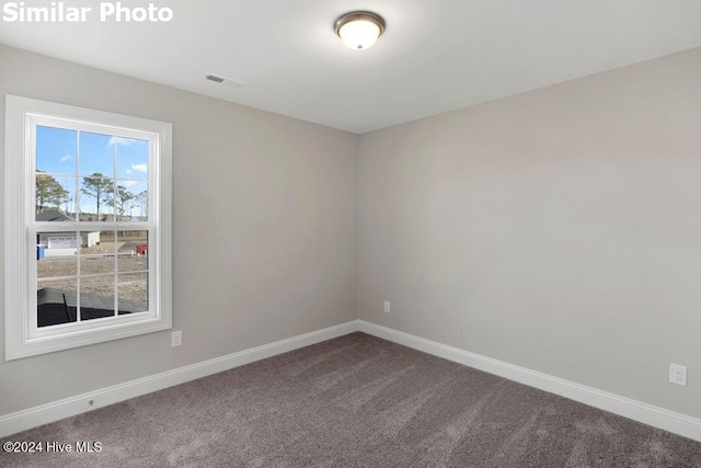 spare room with carpet flooring