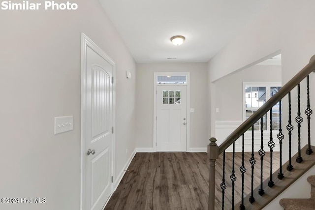 foyer entrance with hardwood / wood-style floors