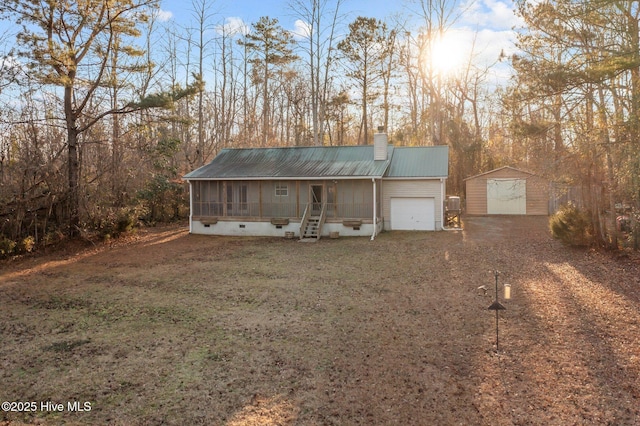 exterior space with a yard and a sunroom