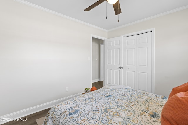 bedroom featuring ornamental molding, wood finished floors, and baseboards