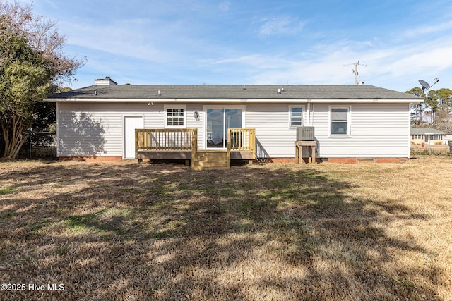 back of house featuring crawl space, a lawn, and a wooden deck