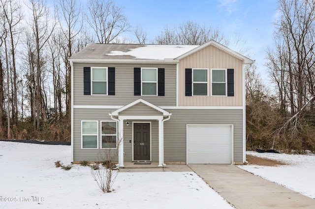 view of front of property with a garage