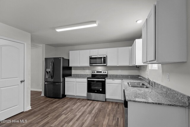 135 Chase Dr, Snow Hill, NC 28580 - kitchen with white cabinetry and appliances with stainless steel finishes