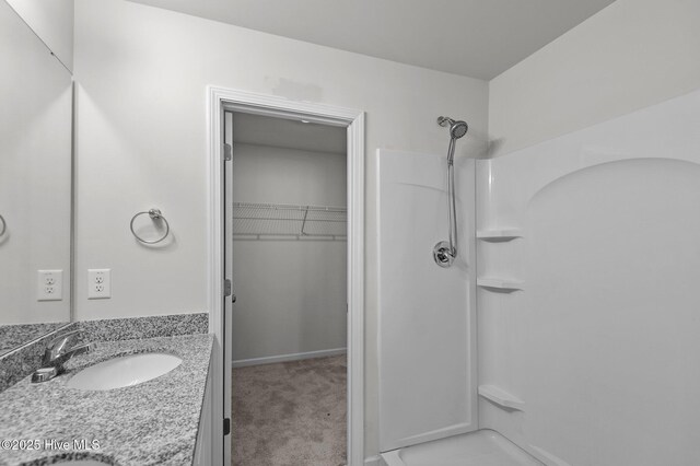 135 Chase Dr, Snow Hill, NC 28580 - unfurnished bedroom featuring carpet floors, baseboards, and connected bathroom
