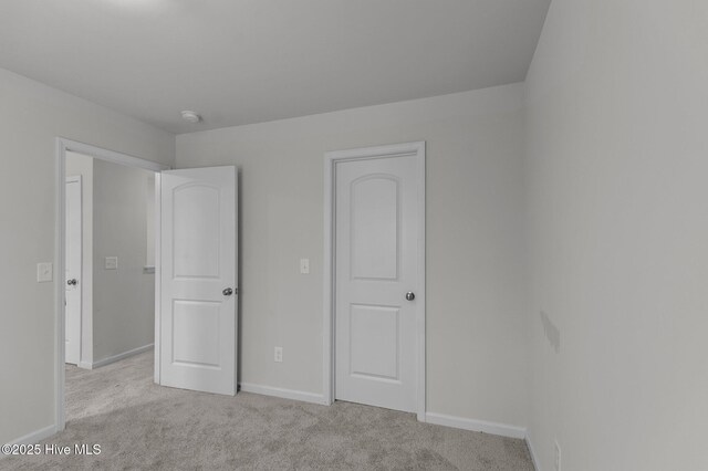 135 Chase Dr, Snow Hill, NC 28580 - empty room featuring baseboards, light colored carpet, and visible vents