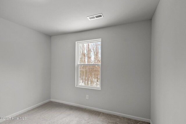 135 Chase Dr, Snow Hill, NC 28580 - unfurnished bedroom with baseboards, carpet flooring, and connected bathroom