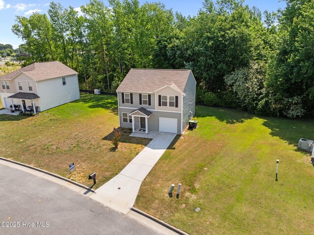135 Chase Dr, Snow Hill, NC 28580 - traditional home featuring an attached garage and central AC unit