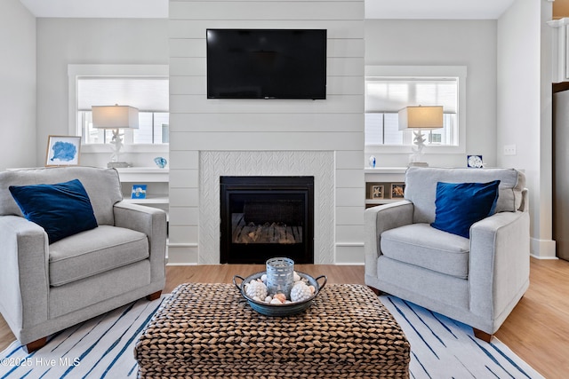 living room featuring plenty of natural light and hardwood / wood-style floors