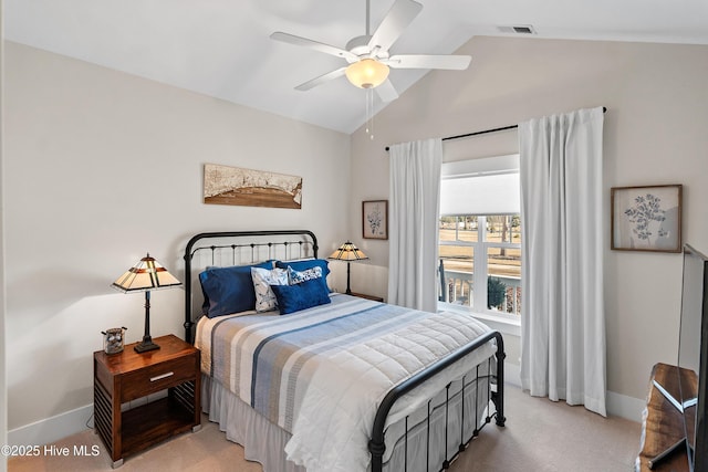 carpeted bedroom featuring ceiling fan and vaulted ceiling