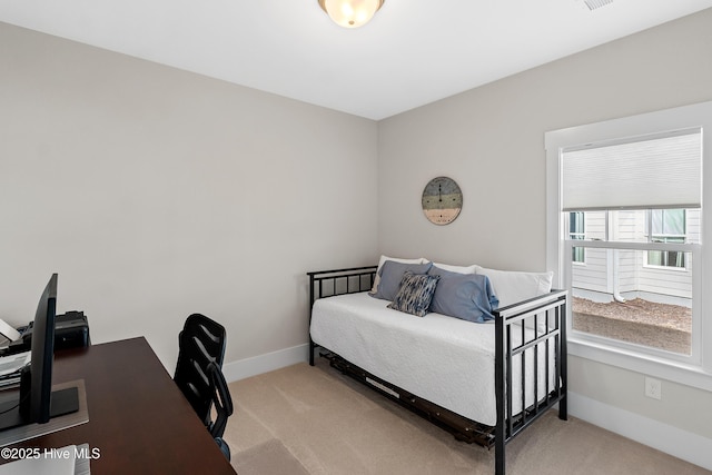 bedroom with light colored carpet