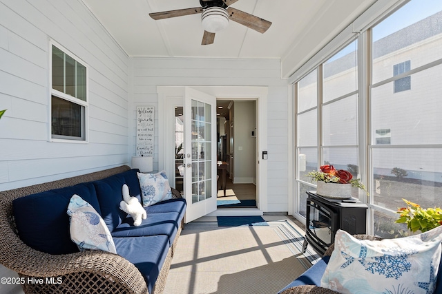 sunroom with ceiling fan and french doors