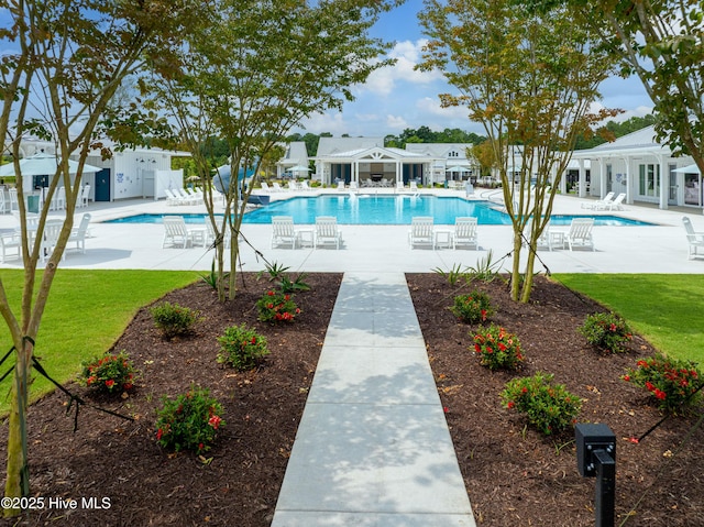 view of swimming pool with a patio area