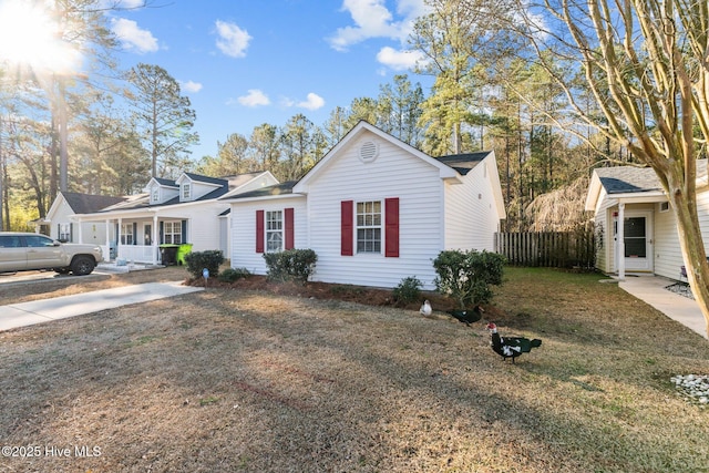 ranch-style home with a front lawn