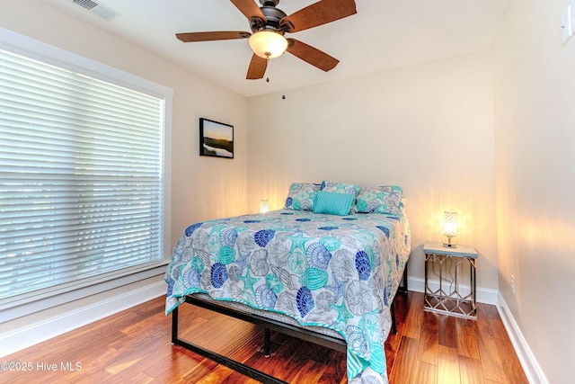 bedroom featuring hardwood / wood-style floors and ceiling fan