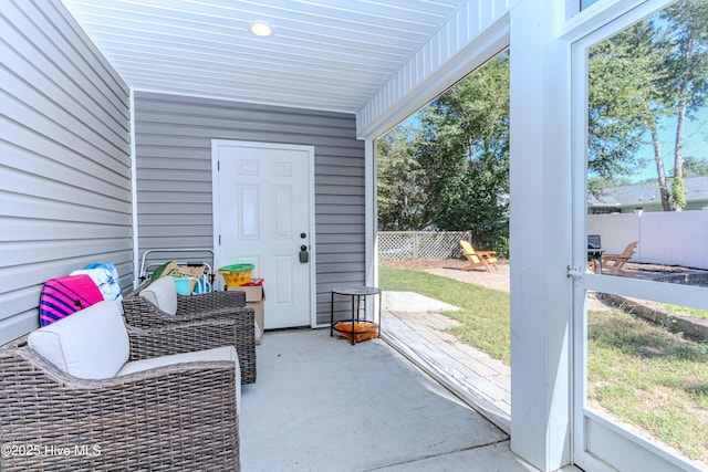 property entrance featuring a patio