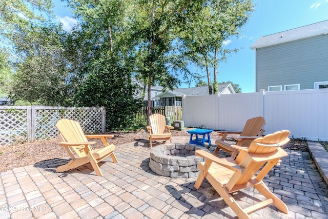 view of patio featuring a fire pit