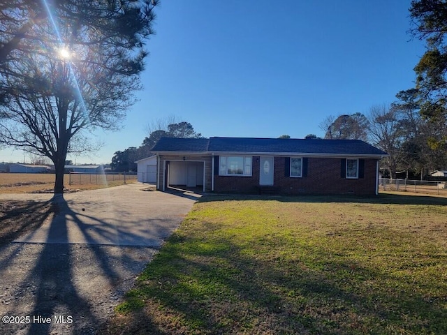 view of front of house featuring a garage and a front yard