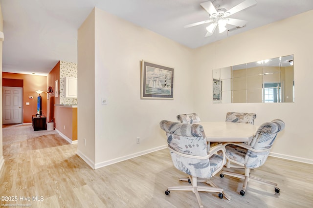 dining room featuring ceiling fan and light hardwood / wood-style floors