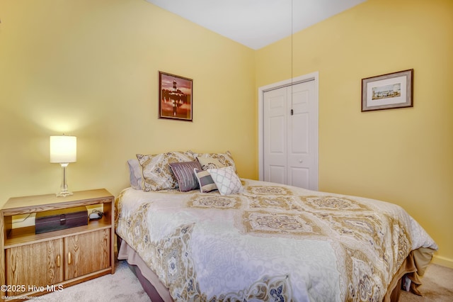 carpeted bedroom featuring a closet