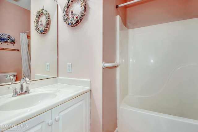 bathroom with shower / bath combo and vanity