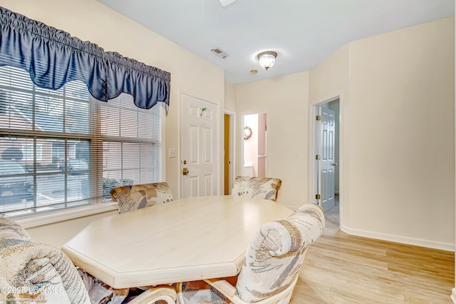 dining room with light wood-type flooring