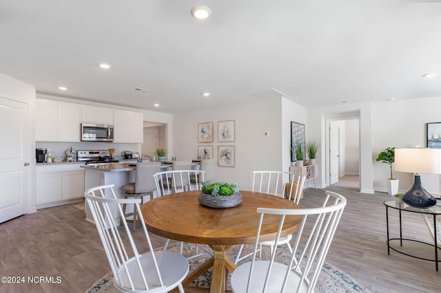 dining area with light hardwood / wood-style floors