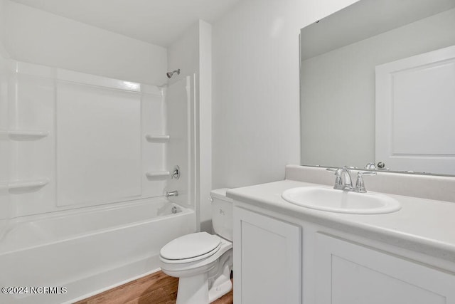 full bathroom with toilet, shower / bath combination, vanity, and hardwood / wood-style flooring